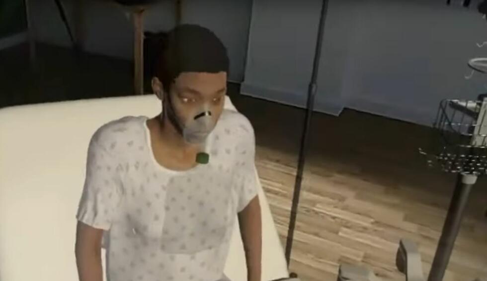 A virtual patient with a breathing mask sits on a hospital bed.