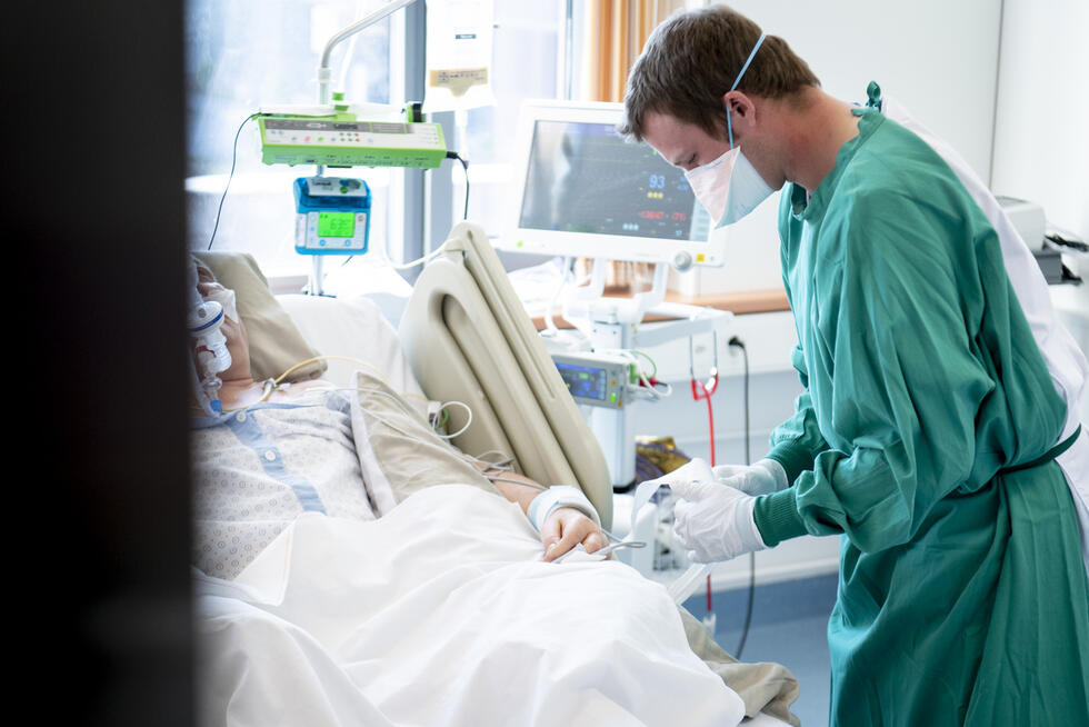 Male nurse taking care of a patient