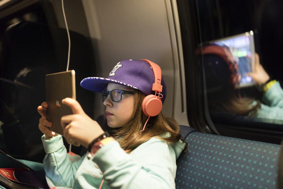 Child playing a video game on a tablet