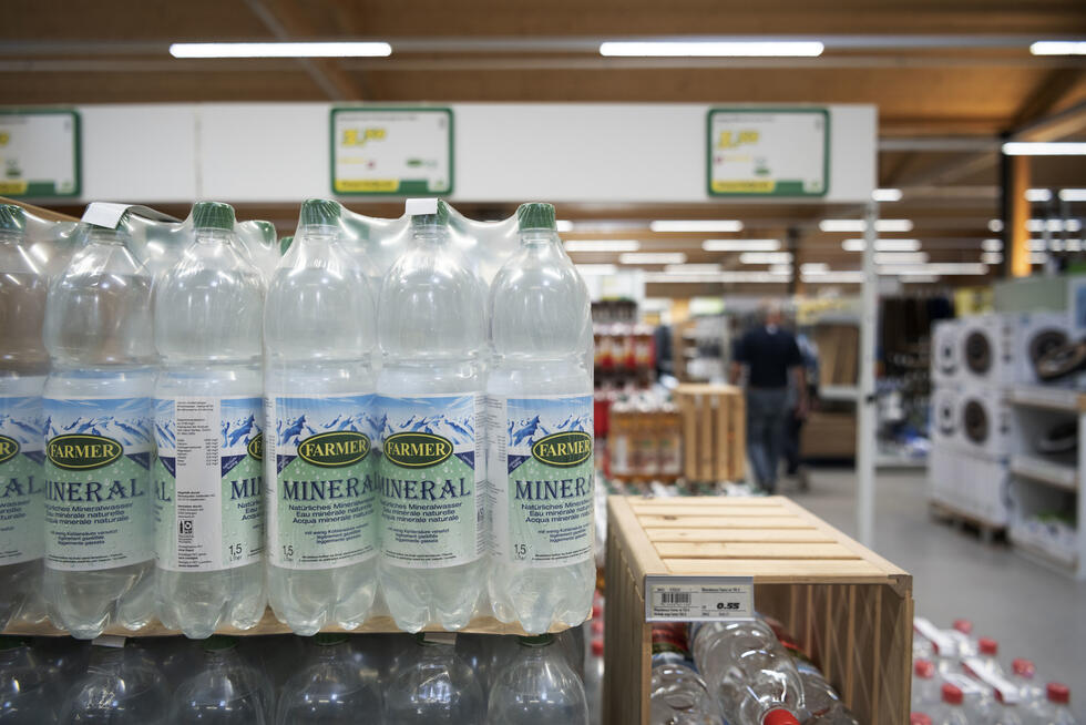 a shop shelf full of plastic bottles